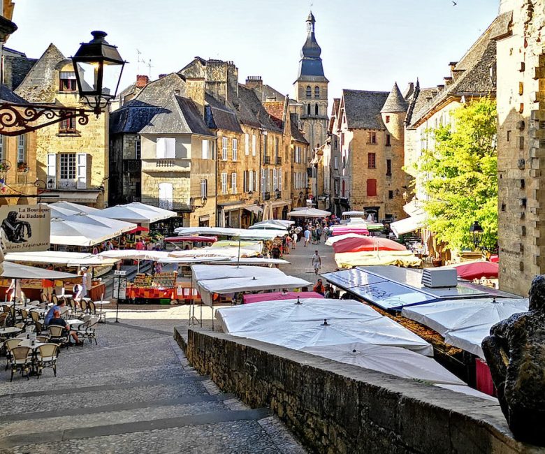Location shot of a cafe in the village Sarlat square